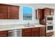 Kitchen featuring a stainless steel dishwasher, sink, and oven at 18514 W Williams Rd, Surprise, AZ 85387