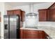 Kitchen with stainless steel appliances, white backsplash, and granite counters at 18514 W Williams Rd, Surprise, AZ 85387