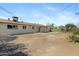 Spacious backyard featuring a covered patio, perfect for outdoor living and entertaining at 2030 E Alder Cir, Mesa, AZ 85204