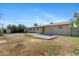 Expansive backyard with a concrete patio, offering ample space for various activities and relaxation at 2030 E Alder Cir, Mesa, AZ 85204