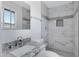 Bathroom with a shower and tub combo, updated fixtures, and granite countertops at 2030 E Alder Cir, Mesa, AZ 85204