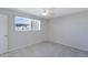 Bedroom with a ceiling fan, tiled floors, and a bright window at 2030 E Alder Cir, Mesa, AZ 85204