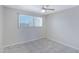 Bedroom with a ceiling fan, tiled floors, and a bright window at 2030 E Alder Cir, Mesa, AZ 85204