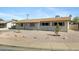 Charming single-story home with neutral colored exterior and desert landscaping at 2030 E Alder Cir, Mesa, AZ 85204
