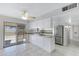 Bright kitchen featuring granite countertops, stainless appliances and tile flooring at 2030 E Alder Cir, Mesa, AZ 85204