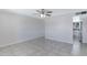 Bright living room featuring tile flooring and access to the kitchen at 2030 E Alder Cir, Mesa, AZ 85204