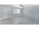 Bright living room featuring tile flooring and a ceiling fan at 2030 E Alder Cir, Mesa, AZ 85204