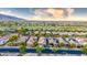 Stunning aerial view of the property showcasing lush green golf course and mountain views at 20784 W Minnezona Ave, Buckeye, AZ 85396
