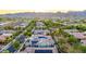 Panoramic aerial view of a residential neighborhood, mountains and solar panels at sunset at 20784 W Minnezona Ave, Buckeye, AZ 85396