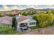 Charming backyard featuring a covered patio, putting green, and outdoor entertainment area at 20784 W Minnezona Ave, Buckeye, AZ 85396