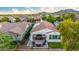 Aerial view of backyard showing patio with fire pit and outdoor seating at 20784 W Minnezona Ave, Buckeye, AZ 85396