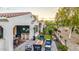 Stunning outdoor living space featuring a grill, fireplace, and putting green at 20784 W Minnezona Ave, Buckeye, AZ 85396