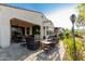 Expansive backyard features covered patio, outdoor seating around a fire pit, and manicured landscaping at 20784 W Minnezona Ave, Buckeye, AZ 85396