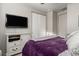 Relaxing bedroom features a TV, closet, and calming color palette, designed for rest at 20784 W Minnezona Ave, Buckeye, AZ 85396