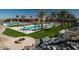 A luxurious community pool area surrounded by lush palm trees, great for relaxation at 20784 W Minnezona Ave, Buckeye, AZ 85396