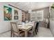 Elegant dining room featuring a stylish chandelier, formal seating, and ample natural light for memorable gatherings at 20784 W Minnezona Ave, Buckeye, AZ 85396
