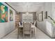 Elegant dining room with chandelier, artwork, and shelving, ideal for Gathering meals and entertaining at 20784 W Minnezona Ave, Buckeye, AZ 85396
