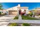 Charming single-story home showcases a tile roof, arched entryway, and colorful landscaping at 20784 W Minnezona Ave, Buckeye, AZ 85396