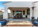 Spacious covered patio with outdoor seating and fire pit perfect for outdoor relaxation and entertainment at 20784 W Minnezona Ave, Buckeye, AZ 85396