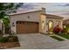 Charming home with mature landscaping, a driveway, and a two-car garage at 20784 W Minnezona Ave, Buckeye, AZ 85396