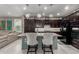 Charming kitchen features pendant lighting, breakfast bar with seating, and modern appliances at 20784 W Minnezona Ave, Buckeye, AZ 85396