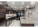 Gourmet kitchen with custom cabinets, granite countertops, stainless steel appliances, and plenty of counter space at 20784 W Minnezona Ave, Buckeye, AZ 85396