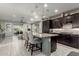 Stylish kitchen with granite countertops, stainless steel appliances, and a breakfast bar perfect for casual dining and entertaining at 20784 W Minnezona Ave, Buckeye, AZ 85396