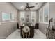Dedicated office space with tile floors, a ceiling fan and shuttered windows at 20784 W Minnezona Ave, Buckeye, AZ 85396