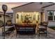 Enjoy a well-appointed patio area, complete with fire pit, comfortable lounge seating and cafe lighting at 20784 W Minnezona Ave, Buckeye, AZ 85396