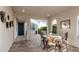 Covered patio with stone flooring and a dining set for outdoor entertaining at 20784 W Minnezona Ave, Buckeye, AZ 85396