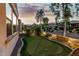 Backyard putting green offers practice with desert views at dusk at 20784 W Minnezona Ave, Buckeye, AZ 85396