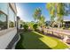 Backyard putting green for golf enthusiasts, surrounded by desert landscaping, perfect for outdoor leisure at 20784 W Minnezona Ave, Buckeye, AZ 85396