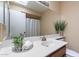 Well-lit bathroom with a single sink, decorative accents, and ample counter space at 2527 E Villa Theresa Dr, Phoenix, AZ 85032