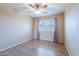 The bedroom has tile flooring and large windows with curtains at 2527 E Villa Theresa Dr, Phoenix, AZ 85032