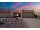 Charming home featuring desert landscaping, a tile roof, and a two-car garage, all under a vivid sky at 2527 E Villa Theresa Dr, Phoenix, AZ 85032