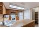 The kitchen features laminate countertops, white appliances, and a skylight at 2527 E Villa Theresa Dr, Phoenix, AZ 85032