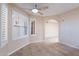 Bright and airy living area featuring tile floors, plantation shutters, and an open floor plan at 2527 E Villa Theresa Dr, Phoenix, AZ 85032