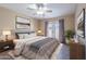 Cozy bedroom with plush bedding, soft lighting, and convenient access to the outdoors through French doors at 2527 E Villa Theresa Dr, Phoenix, AZ 85032