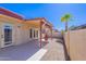 Covered patio with tiled floors and a cozy outdoor fireplace, perfect for entertaining at 2527 E Villa Theresa Dr, Phoenix, AZ 85032