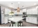 Spacious kitchen with an island, stainless appliances, subway tile backsplash, and ample cabinet space at 2562 N Springfield St, Buckeye, AZ 85396