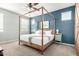 This main bedroom offers a king bed, side tables, and lovely natural light at 2562 N Springfield St, Buckeye, AZ 85396