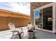Cozy patio with string lights, comfortable seating, and a stylish fire pit, perfect for outdoor entertaining at 2562 N Springfield St, Buckeye, AZ 85396