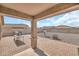 Covered backyard patio overlooking a low-maintenance gravel yard and block fence at 25787 W Allen St, Buckeye, AZ 85326