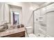 Bathroom with granite vanity, toilet, and glass shower showcasing clean design at 25787 W Allen St, Buckeye, AZ 85326