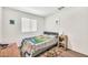 Bedroom featuring a simple color palette, natural lighting and wood floors at 25787 W Allen St, Buckeye, AZ 85326