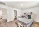 Bright bedroom featuring modern rustic headboard and neutral color palette at 25787 W Allen St, Buckeye, AZ 85326