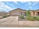 Charming single-story home with a well-maintained front yard and inviting entrance at 25787 W Allen St, Buckeye, AZ 85326