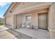 Welcoming front porch with seating area, perfect for relaxing and enjoying the outdoors at 25787 W Allen St, Buckeye, AZ 85326