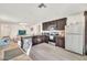 Well-appointed kitchen with stainless steel appliances and views to the living space at 25787 W Allen St, Buckeye, AZ 85326