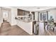 Bright kitchen with granite countertops, dark wood cabinets, and an open concept layout to dining area at 25787 W Allen St, Buckeye, AZ 85326